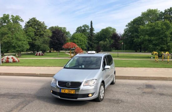 Local taxi car parked at Sigulda railway station in Latvia