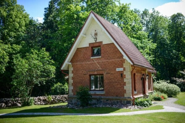 mednieku-namins-cottage-sigulda Mednieku Namins rustic red-brick holiday cottage in a lush green garden